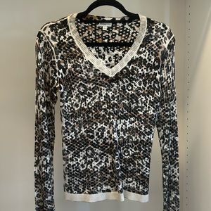 V Neck pull over sweater. Leopard print perforated pattern. Size small